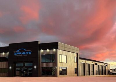 A building's front with a beautiful sunset in the background, creating a serene and picturesque scene.